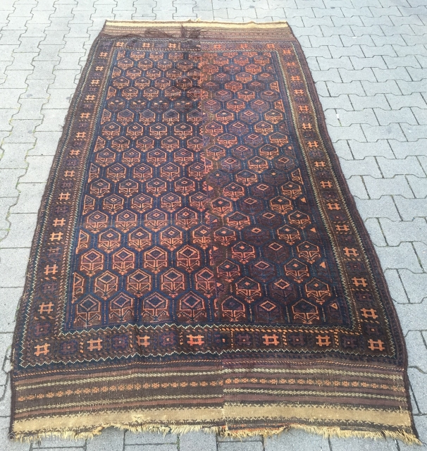 This unusual large antique Baluch rug from West - Afghanistan was woven in two parts. It has long kilim ends. Good overall condition. Size: ca. 280cm x 135cm / 9'2''ft x 4'4''ft  ...