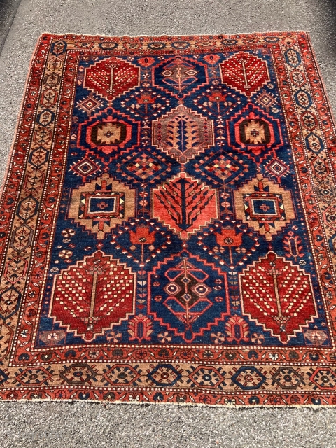 Antique Persian Bakhtiary rug with garden design. The indigo blue field is surrounded by a beautiful camel ground border. Size: circa 197x163cm / 6’5ft by 5’3ft http://www.najib.de      