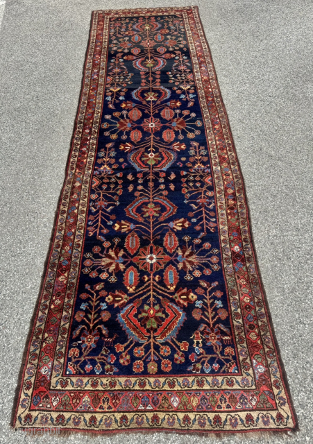 An exceptionally characterful and rare antique Bakhtiari tribal runner featuring an all-wool structure and a deep midnight-indigo field. Unlike urban Bakhtiari workshop productions, this piece displays all the hallmarks of authentic tribal ...