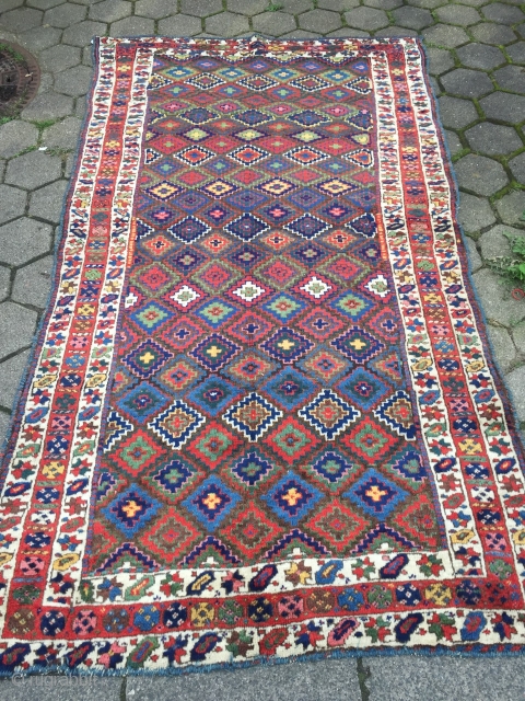 Antique Kurdish Saujbulagh tribal rug with fantastic colors and shiny wool. Circa 1870. Size: ca. 260x140cm / 8'5'' x 4'6''ft The design of this village weaving displays interlocking stepped diamonds that completely  ...