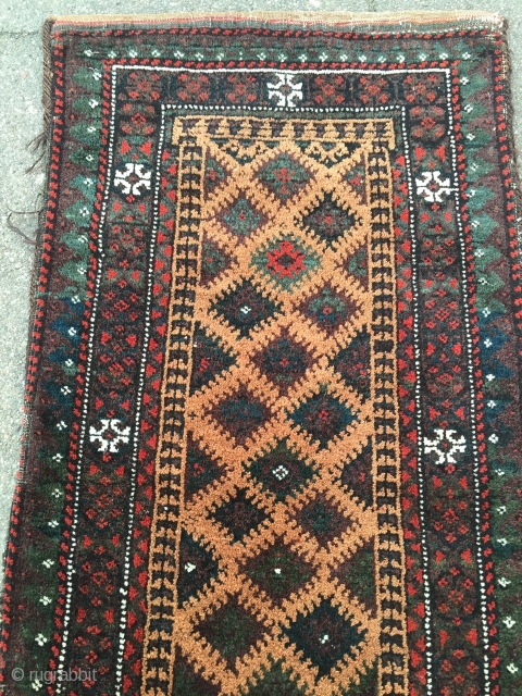 Antique camel ground collector´s Baluch balisht, glossy wool and cool graphics, nice collector´s item. Size: 86x41cm / 2'8''ft x 1'3''ft all natural colors.
          