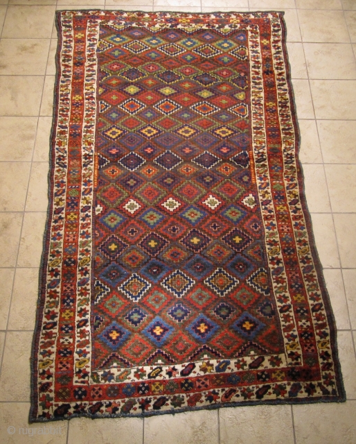 Antique Kurdish tribal rug with fantastic colors and shiny wool. Circa 1870. Size: ca. 260x140cm / 8'5'' x 4'6''ft The design of this village weaving  displays interlocking stepped diamonds that completely  ...