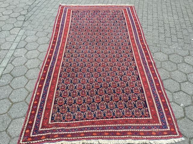 Large antique Afshar tribal rug from Southpersia with a very well drawn Boteh field pattern. Wool foundation, good quality. Size: ca. 305x165cm / 10ft x 5'5''ft some light wear, otherwise good overall  ...