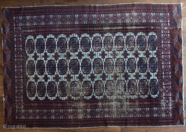 Afghan/Pakistan Turkoman design.

Size 181 cm x  122 cm



Wool pile, cotton warp and weft

Moderate condition: Striking white field, good pile over much of rug, with some thinning. Selvedges largely intact, with minor  ...
