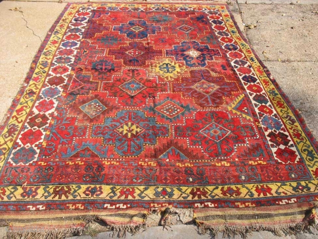 Central Asian Kirghiz or Uzbek Carpet
Size: 6.10-7.1 (width varies) x 11.4 w/skirt.
Needs sidecord work and repairs to skirts. 
As is: $2500.00 PRICE REDUCED!          