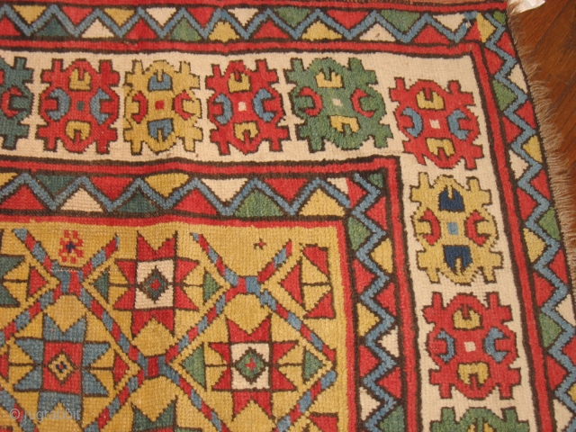 Caucasion Kazak yellow ground 19th century. Unmolested carpet from collector in the 1960's. SMALL RESTORATIONS and ends  are sewn. PRICE REDUCED! 4.4 by 6.2 Bendas Rugs 314-862-4410     