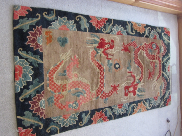 Tibetan: Plush khaden, Two red dragons seeking the flaming pearl, framed by indigo ground main border. Excellent condition, c.1920              