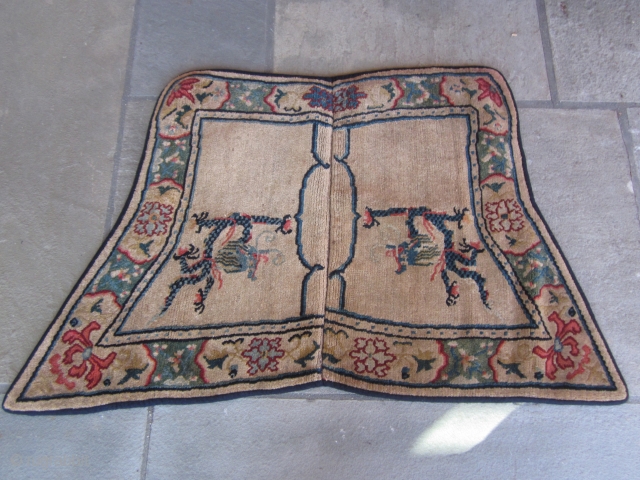 Tibetan butterfly-type saddle, c.1930. Colorful, well-designed border, with dragon stretching to grab the flaming pearl!                  