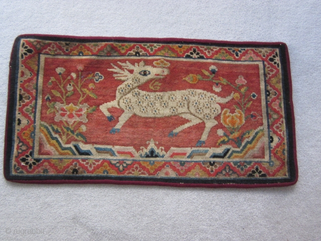 Tibetan : Table mat with deer, 1'6" by 2' 10", c.1930                      