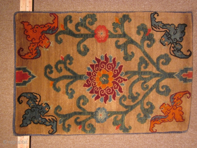 Tibetan mat with tree of life image. The bats at all 4 corners are poised and ready to extract nectar from the flowers. Good color, graphic images, and great condition. c.1920.  