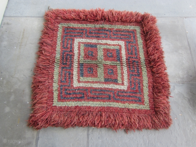 Tibetan wangden sitting  mat with swastika, for temple use, early 20th C. 36 by38 inches                 