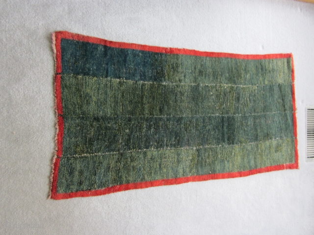 Tibetan tsuk truk,26 by 52 inches Four panels of blue/green, with yellow threads, Thin handle. Low pile                