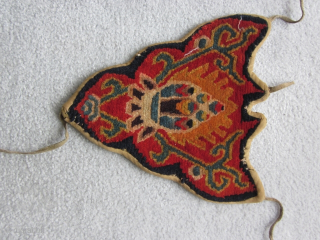 Tibetan teknab, worn on the forehead of pack animals. Unusually large at 11 by 11 inches 20th C.               