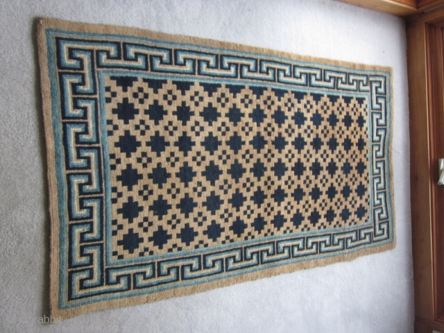Tibetan khaden, overall geometric design in shades of undyed wool and a border with shades of indigo. About 3 by 5 feet. c.mid-20thC.Excellent condition. Wefting suggests a village product. Not expensive.  