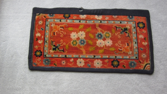 Tibetan, small mat, 18 by 35 inches, possibly for table top use.Sewn on border covers about 1 inch of outer edge. After 1900          