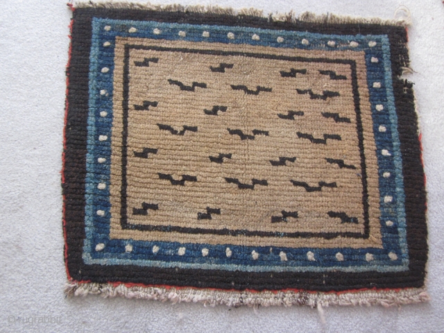 Tibetan, mat with tiger stipes,20 by 25 inches, 1900 or earlier. Small nibble in upper right border. From private collection of 30 years standing  SOLD       