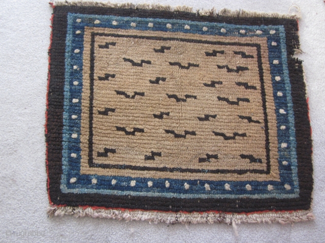 Tibetan, mat with tiger stipes,20 by 25 inches, 1900 or earlier. Small nibble in upper right border. From private collection of 30 years standing  SOLD       