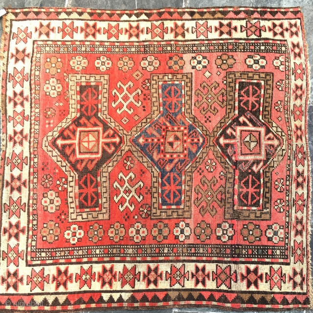  ANTIQUE KAZAK FACHRALO CAUCASIAN RUG 3'9" x 3'10"

In fair condition, flat pile, some professional re knotting.both ends secured missing one stripe.

As you may see part of a private collection #11
So Classic  ...