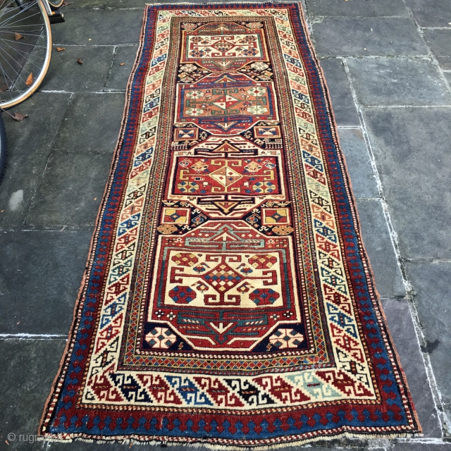 Shirvan Runner Last Quarter 19 Century: 3'3" x 8'9"

This exciting antique Caucasian runner of Shirvan design is characterized by expertly detail work, and an exciting treatment of color, from the stacked medallion  ...