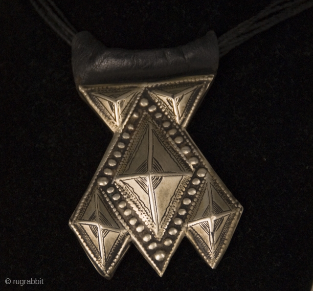 Old Khomeissa,  pure silver and leather hand made amulet from Niger.
Khomeissa, a silver or shell pendant composed of 5 triangles, a variation of the Khamsa or Hand of Fatima worn by  ...