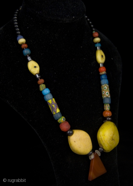 Old Millefiori, Venice mixed, Gablonz, Bohemia, yellow Kiffa glass beads, from Mauritania. Adrar region.

size: 

lenght: 33 cm

diameter of beads: 0,5 cm-3,0 cm           