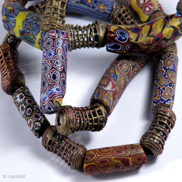 Venice Millefiori trade glass beads (1850-1950), bronze Baoule beads necklace.  From Mali, Africa

Size: lenght 70 cm; diameter of beads 0,8-1,5 cm

Bibl. Ref. Sherr Dubin "The history of beads"    