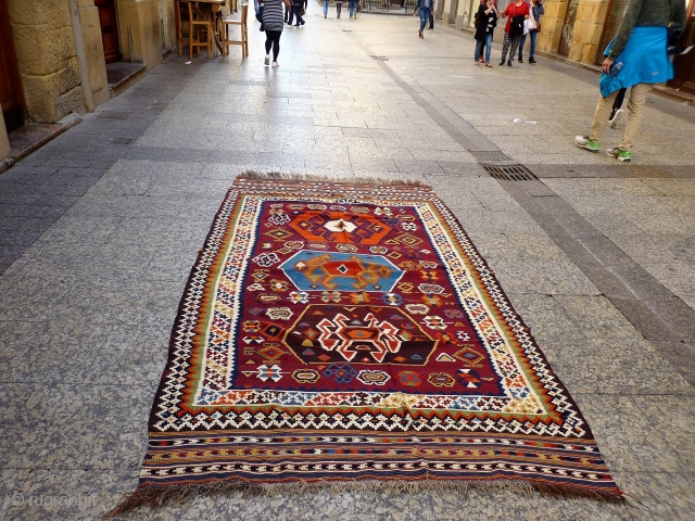 A remarkable antique Qashqai kilim with a dramatic design consisting of three large medallions, and the field filled with scattered motives throught.  The wool soft, shinny and finelly spun.In mint condition.  ...