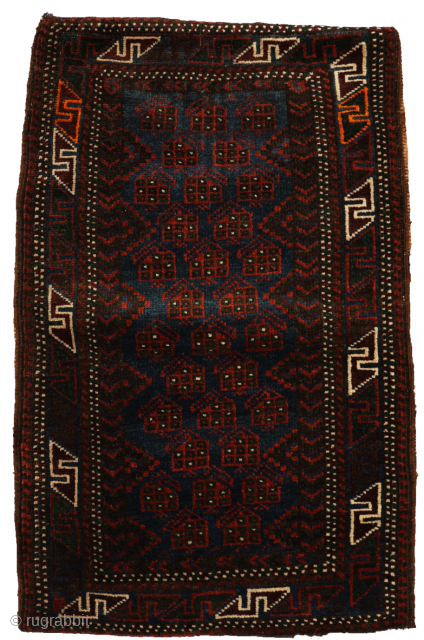 This antique balisht or cushion was woven by a woman from the Baluch tribe of Afghanistan. The wool is soft and silky and the dyes are natural. The central field is filled  ...