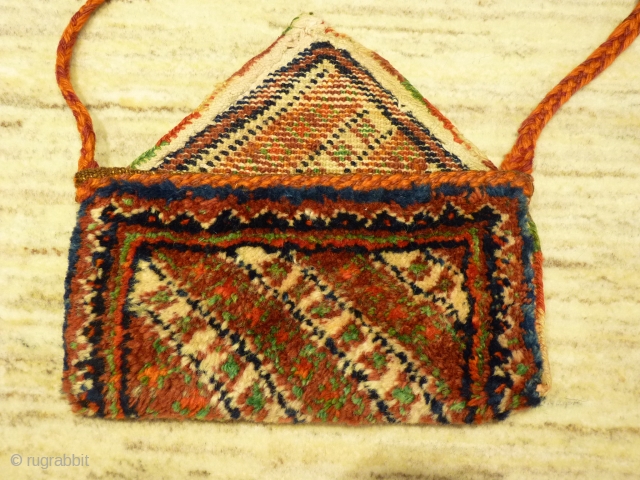 Arabic nomads (southern Iran) tobacco or money pouch, 24x12cms, woven in one piece with thick soft wool pile, from about 1940.            