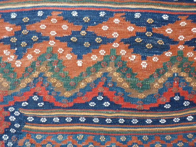 Rare small format Afsari kilim, 195x175cms, harmonious natural colours and design with repeating flower motif and extra wide border. White cotton warp and details. We find this very beautiful.    