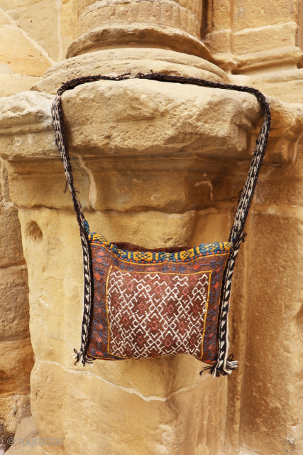 This Qashqai bag has been woven with wool dyed with natural colours. The back of the bag has some interesting motifS. The woolen handle is a latter addition and can be easily  ...