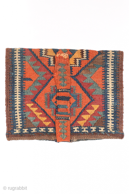 A rare Kurdish bag that has been opened out. This chanteh originally was folded in halve resulting in a square bag. The rectangular long and narrow strip was used to close the  ...