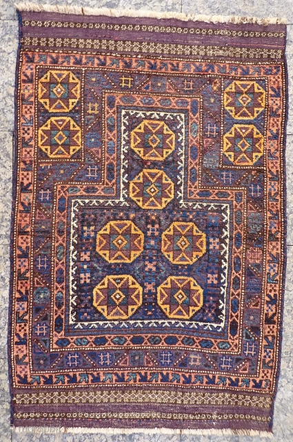 A coarsely woven Belouch prayer rug with a very tribal feel. The handling of the piece is similar to a loose gabbeh. Very soft and shinny wool. The field and the outside  ...