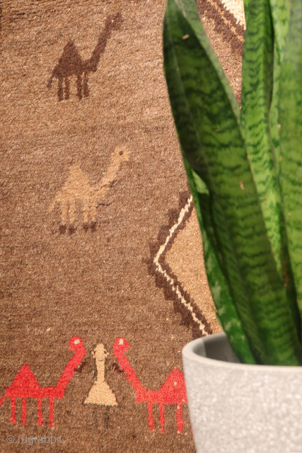 An unusual Qashqai gabbeh rug, likely woven with undyed natural camel wool. The rich color suggests the use of camel wool, and the weaver even included some camels in the design. Charming ...