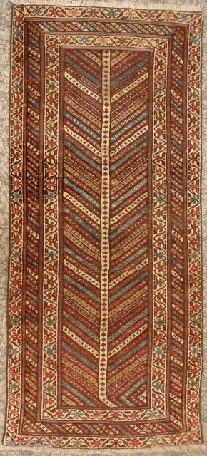 Lovely Kazak Gendje runner with earthy colours, and a lot of undyed wool. Low to medium overall pile, some repiling. With the arrival of the spring the branches started blooming! 198x88 cms,  ...