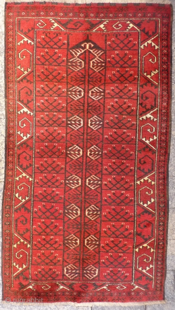 This large Turkman Hajloo arif Khag prayer rug is framed by a large scale border. The colour palette is restricted to only 3 colours, and the wool is soft and shinny. In  ...