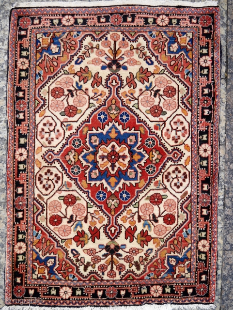 A very fine pushti or small rug from Malayer, Iran, with a high density knot count, soft shinny wool, all good colours,full pile, in one side the original kilim end, and in  ...