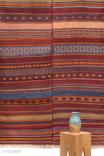 A stunning Taimani Aimaq Baluch kilim kilim from Afghanistan, distinguished by its beautiful and varied colour palette. The colours are predominantly natural dyes, including a deep indigo blue, a rich pistachio green, ...