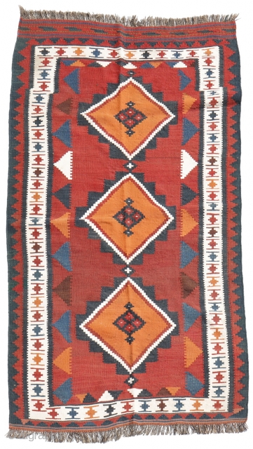 kilim from the Lori or Luri tribe of Iran. This kilim stands out for the three large medallions that occupy the entire central field. All dyes are natural. The weft, as seen  ...