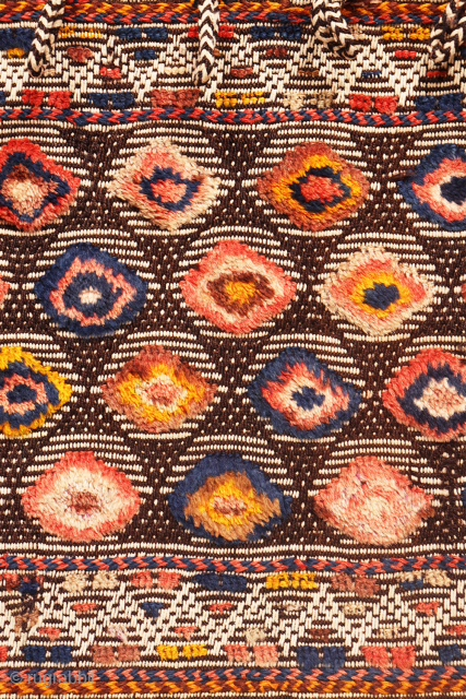 Are you searching for a truly unusual and original saddlebag? Look no further.

The captivating design of this antique Qashqai saddlebag was achieved using the warp-float weave technique. This specialized method is typically  ...