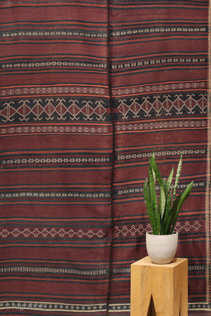 A beautiful antique Baluch kilim woven with finely hand-spun wool. This exceptionally dark antique kilim is difficult to photograph, and the images do not fully capture the richness of its natural colours ...