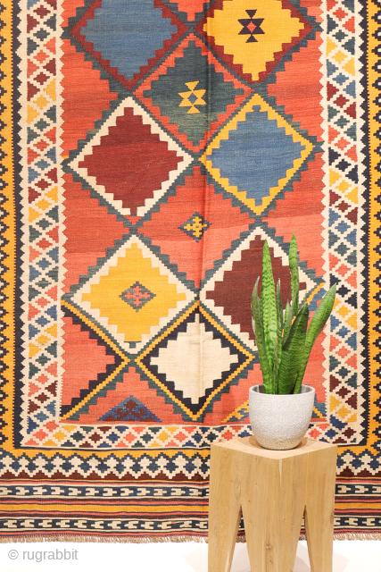 Antique Qashqai Kilim with gabbeh like Design.

This antique Qashqai kilim features a superb design brought to life with richly saturated natural dyes, including deep indigo blue, emerald green, and mustard tones. The  ...