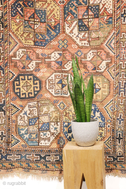 A North West Persian Kurdish rug featuring an oversized design with a large octagon placed in each corner. The central field contains smaller secondary motifs, creating a structured yet lively arrangement.

While the  ...