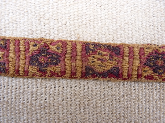 A Huari Culture band, 8th to 12th century, Huari Culture , South Central Perú. Wool. From a Spanish private collection. 39x2,8 cms. (T1511011)          