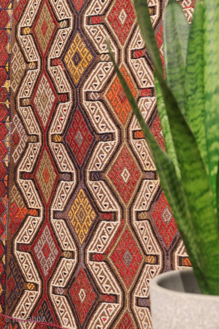 An Adana kilim with a distinct tribal character.
This Adana kilim is woven on an undyed brown wool background and decorated using the cicim technique. While the weaver created a repetitive pattern, she ...
