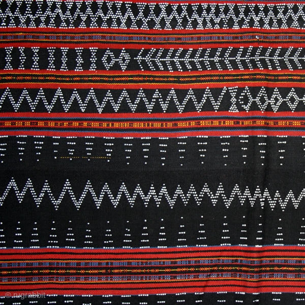 Loincloth cod. 0416. Dyed cotton with glass beads woven in the cloth. Cotu culture. Central Highlands. Vietnam. Early/mid. 20th. century. Very good condition. Cm. 135 x 150 (53 x 59 inches).  