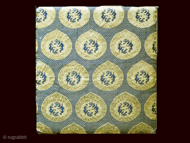 Kinran Kesa fragment cod. 0856. Gold foil, paper. Japan.  19th Century. Size cm. 23 x 25 (9” x 10”). Very good condition. Mounted on a wooden frame.
This exquisite textile fragment showcases  ...
