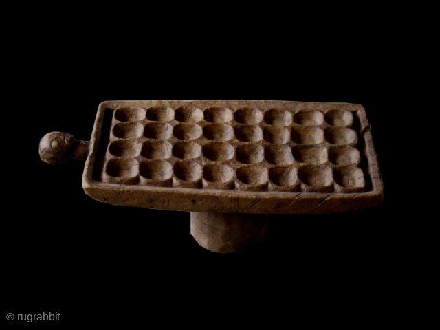 Game board cod. 0149. Carved wood. Luba people. South East region D.R. of Congo. Mid. 20th. century. Good condition with corrosion to the leg. Cm. 76 x 34 x 26 h. (2'6" ...