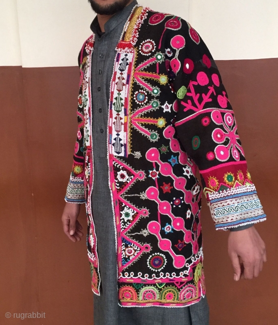 A Mangal man's woolen coat from Paktya Afghanistan 
It is made from a handwoven local patti cloth.The coat is decorated with woolen embroidery done with hand.       