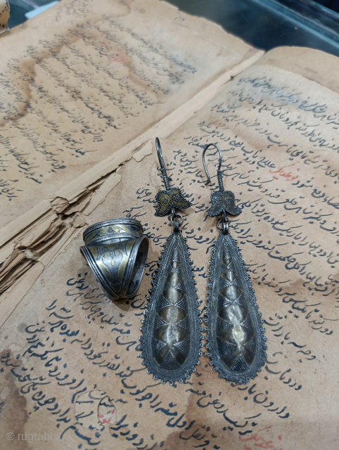 A rare 19th century gilded high quality silver earrings and a fine gilded high quality silver ring circa mid 20th century from the turkman tribe of Afghanistan.Nooristanartgallery@yahoo.com